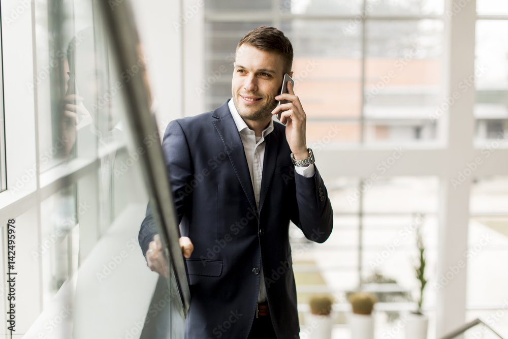 Businessman having phone call in the office Businessman having phone call in the office