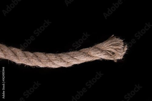 Thick rope on a black background. Sea rope