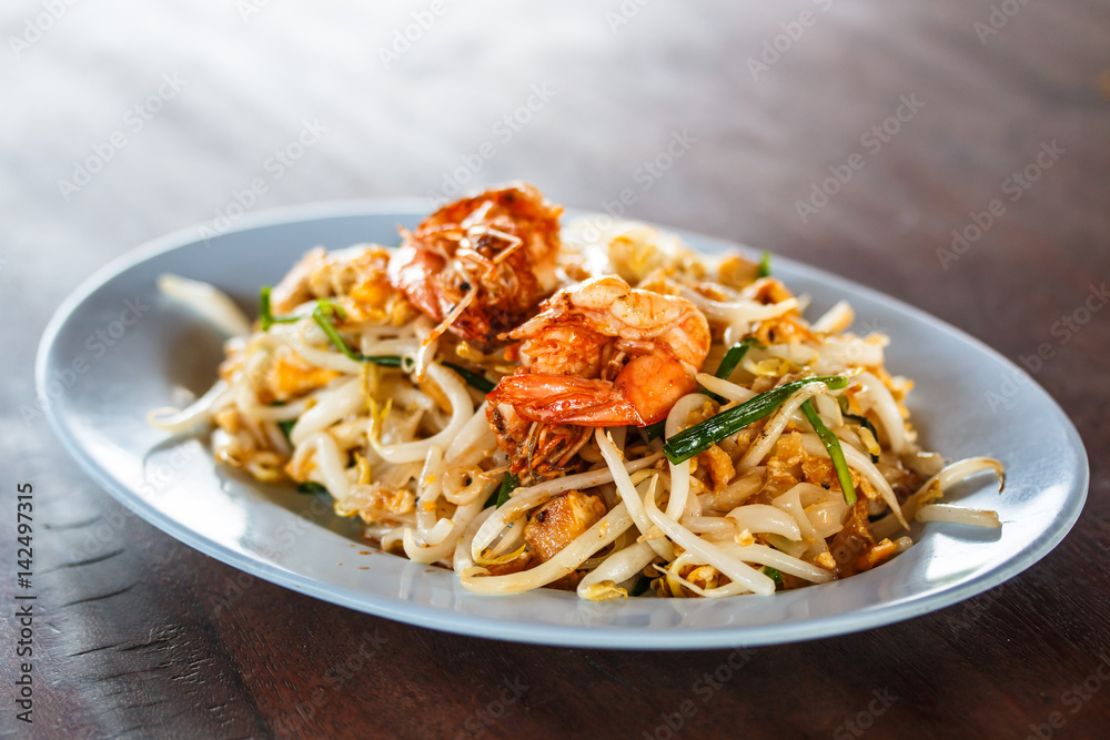 Stir-fried rice noodles, is one of Thailand's national main dish called Pad Thai. Stir-fried rice noodles, is one of Thailand's national main dish called Pad Thai.
