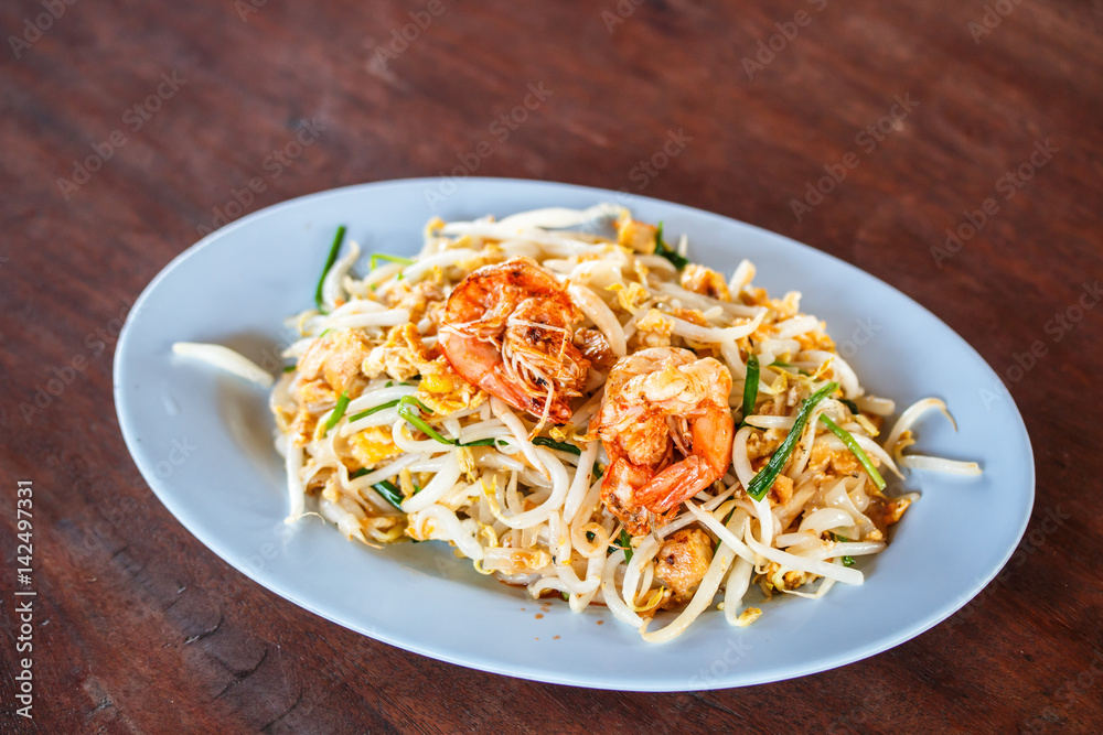Stir-fried rice noodles, is one of Thailand's national main dish called Pad Thai. Stir-fried rice noodles, is one of Thailand's national main dish called Pad Thai.