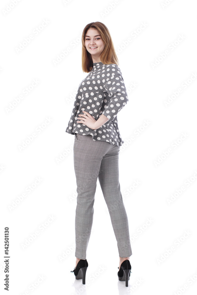 Young beautiful blonde woman in gray trousers Young beautiful blonde woman in gray trousers
