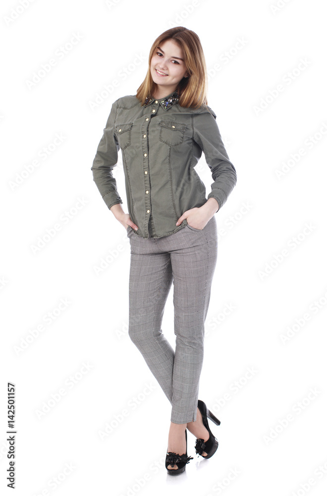 Young beautiful blonde woman in gray trousers Young beautiful blonde woman in gray trousers