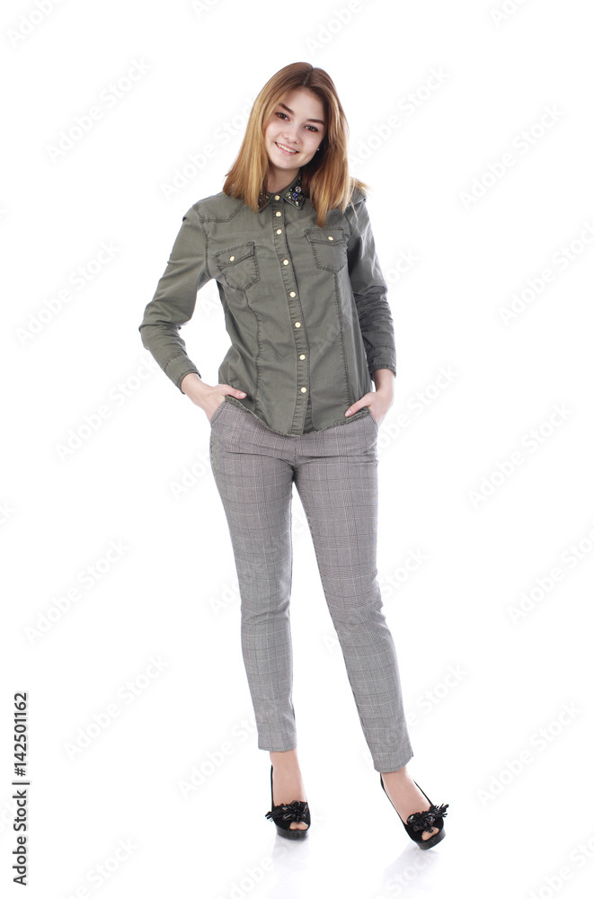 Young beautiful blonde woman in gray trousers Young beautiful blonde woman in gray trousers