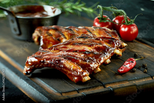 Spicy hot grilled spare ribs from a summer BBQ photo