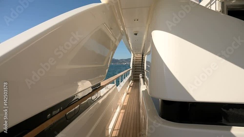 Large lateral passageway on a luxury yacht.