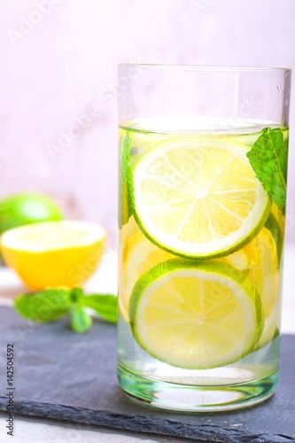 Summer drink with lime, mint and lemon