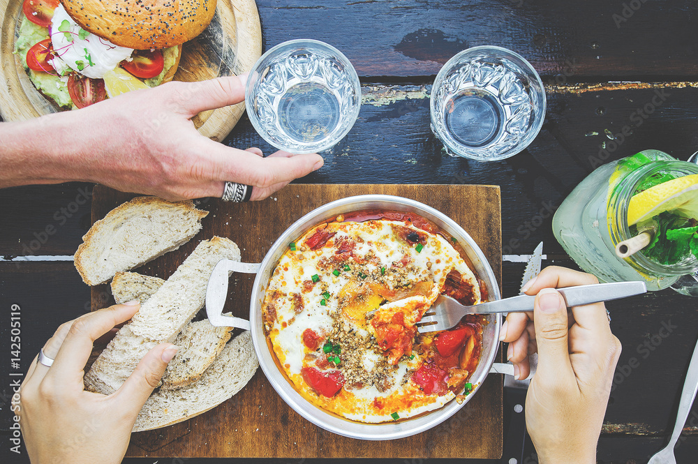 Shakshuka with bread in a pan. close up eating