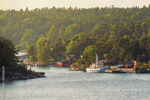 Tugboat at small idyllic po...