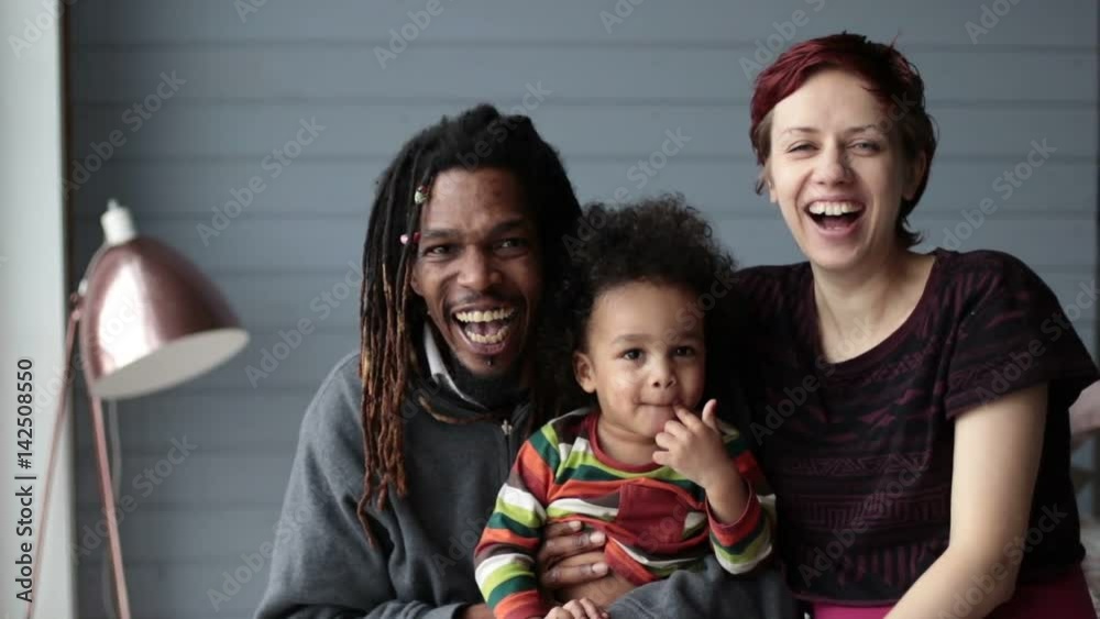 Portrait of beautiful mixed race family smiling