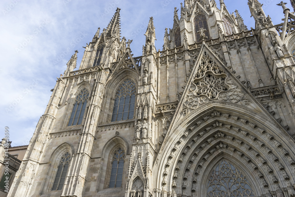 Fototapeta premium Tourism, Facade of the Cathedral of Barcelona located in the old part of the city, catalonia, spain