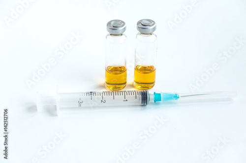 ampoules and syringe. medical ampoules with syringe isolated on white background. Medicine in vials and syringe ready for injection. 