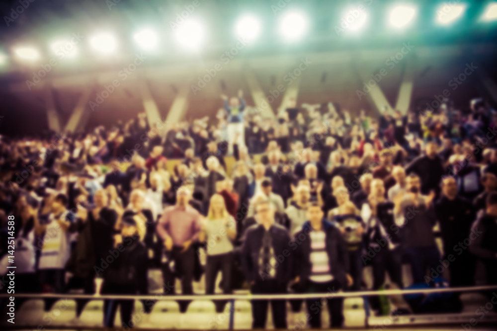 Naklejka premium blurred background of crowd of people in a basketball court
