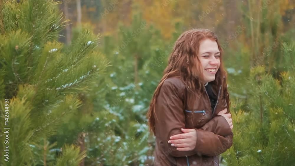 Ginger Woman Laughing Standing Under Snowfall Ginger Woman Laughing Standing Under Snowfall