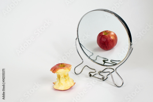 Eating Disorder, Anorexia, Bulimia, Binge Eating, Apple in Mirror photo