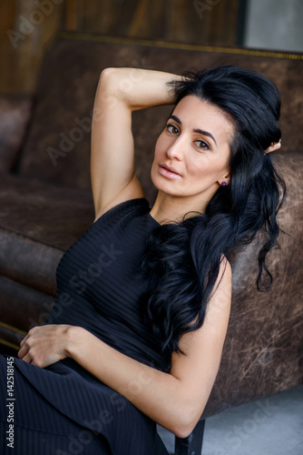 stylish young brunette with long hair © Vasiuk Iryna