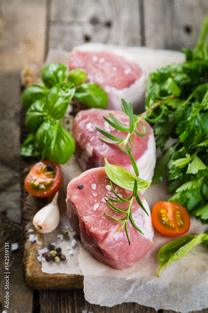 Raw filet mignon meat cuts with spice and herbs Raw filet mignon meat cuts with spice and herbs