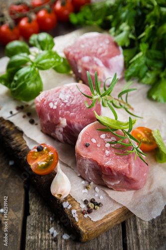 Raw filet mignon meat cuts with spice and herbs