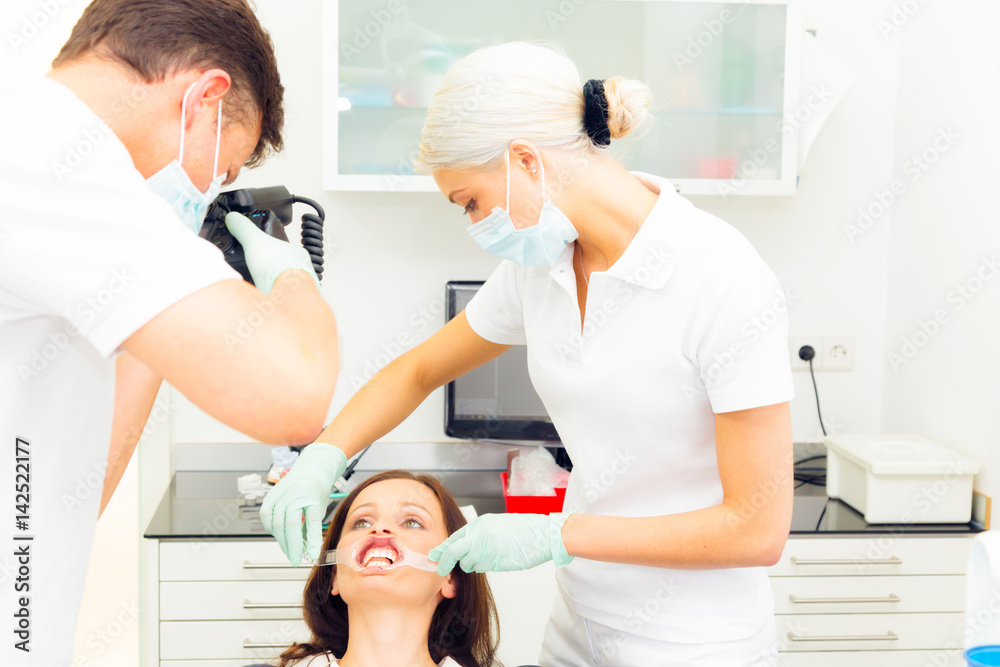 Fototapeta premium Dentist Taking A Photo Of Patient's Teeth