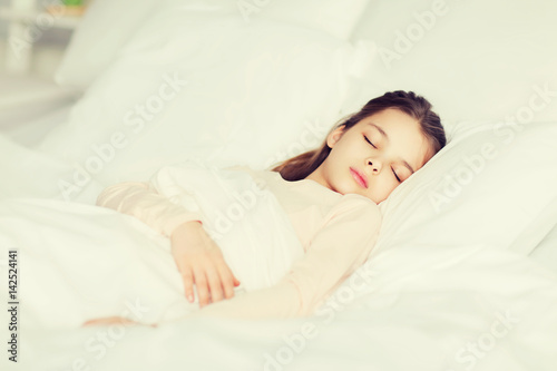 girl sleeping in bed at home © Syda Productions