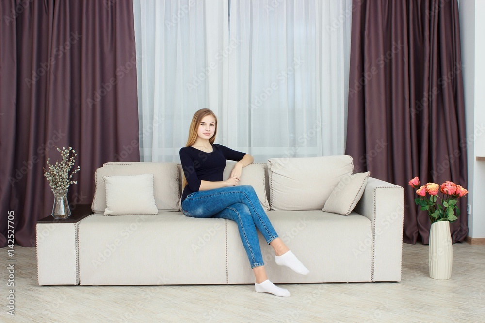 cute young girl relaxing on couch at home cute young girl relaxing on couch at home