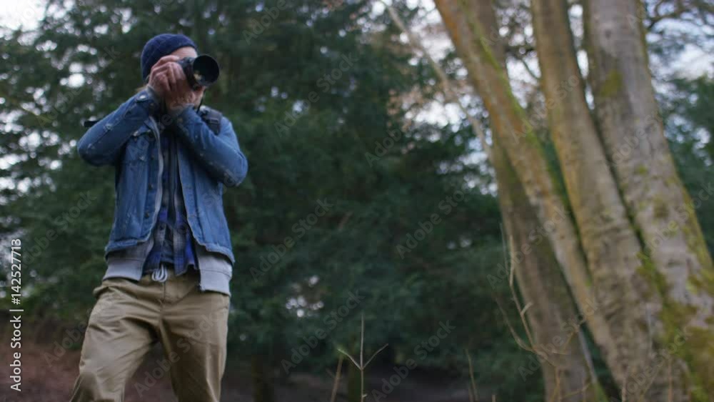4K Photographer takes a photo as he enjoys the view in the forest 4K Photographer takes a photo as he enjoys the view in the forest