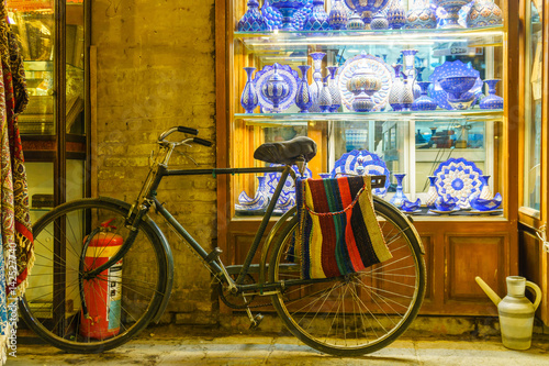 handicraft at bazaar of isfahan with bike an pottery photo