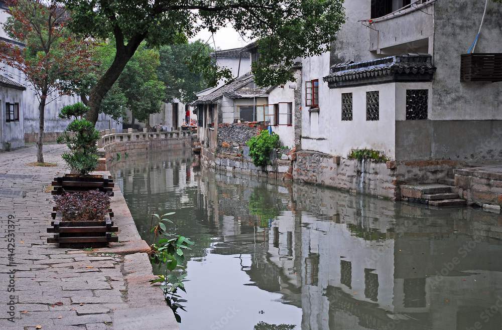 China, Shanghai water village Tongli. Reflection in a typical village canal.