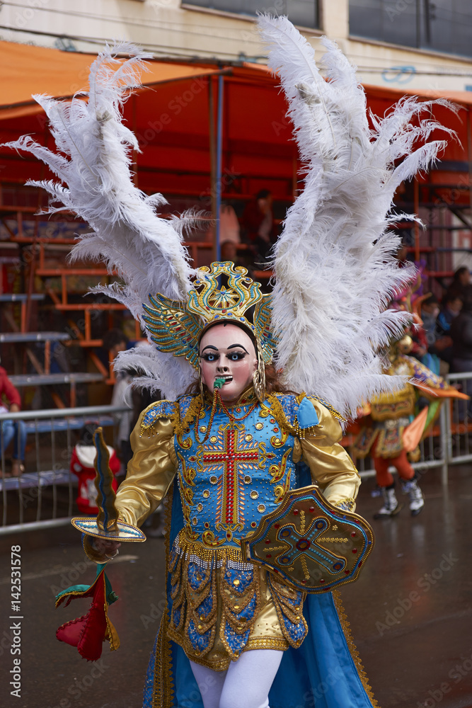 Diablada dancer in ornate costumes parade through the mining city of Oruro on the Altiplano of Bolivia during the annual carnival.