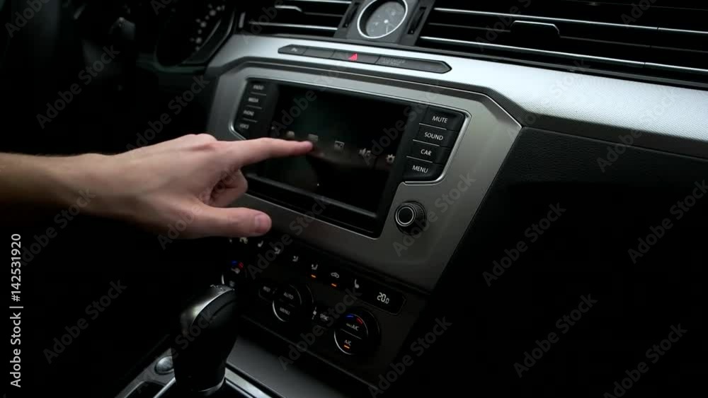 Man look through the menu in the car. Man look through the menu in the car.