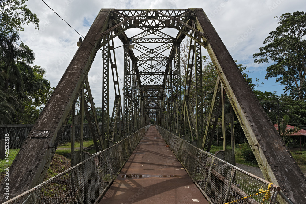Old railway and border bridge across the Sixaola River between Costa Rica and Panama
