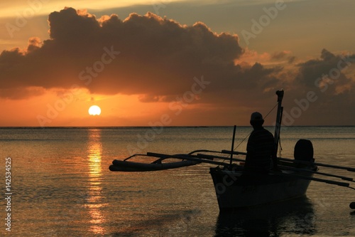 Fisherman at sunset, Saipan, CNMI