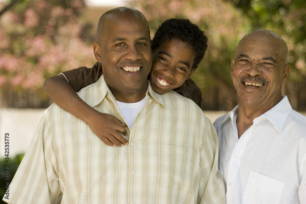 Grandfather with his adult son and grandchild.