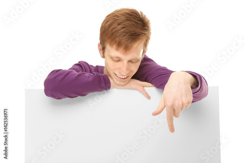 Teenager with poster on white background