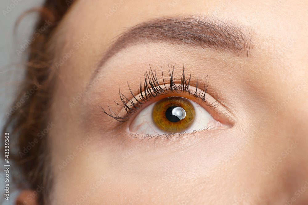 Brown-eyed female face, closeup Brown-eyed female face, closeup