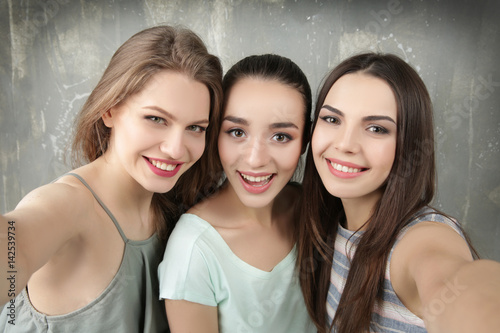 Beautiful young women takin...