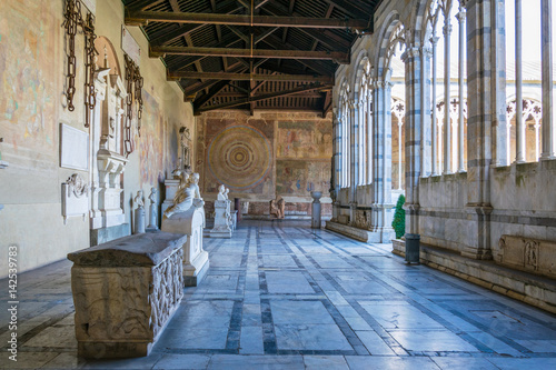 view of a corridor of the camposanto cemetery in Pisa, Italy