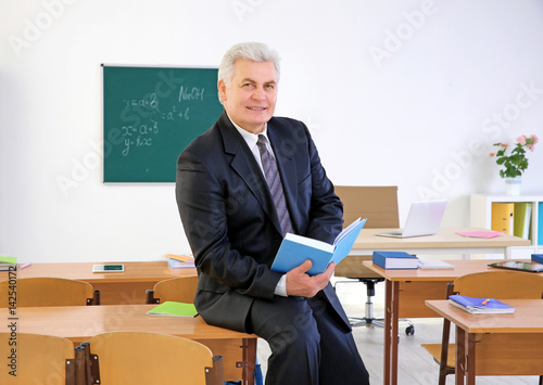 Portrait of senior teacher ...
