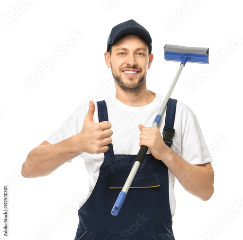 Young window cleaner on whi...