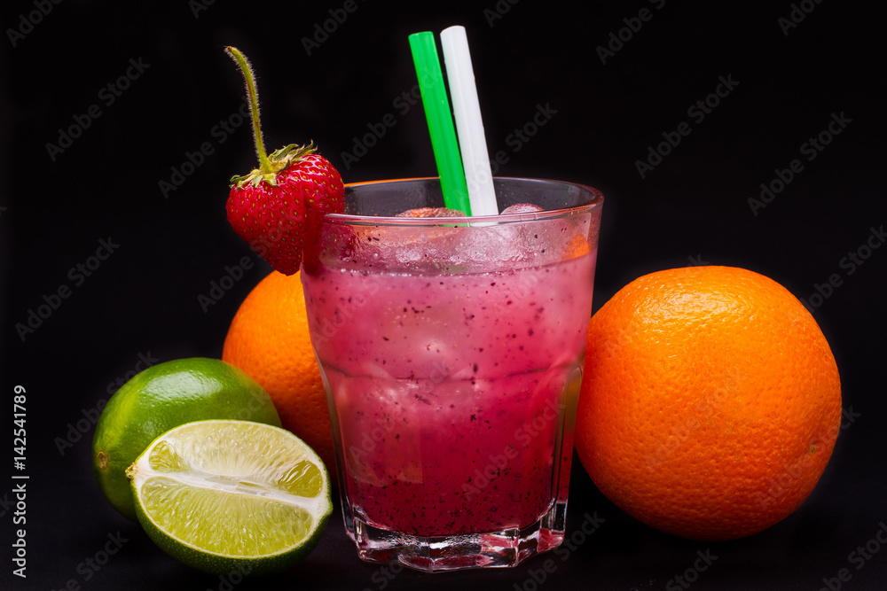 Fototapeta premium strawberry cocktail in glass with straw on black background
