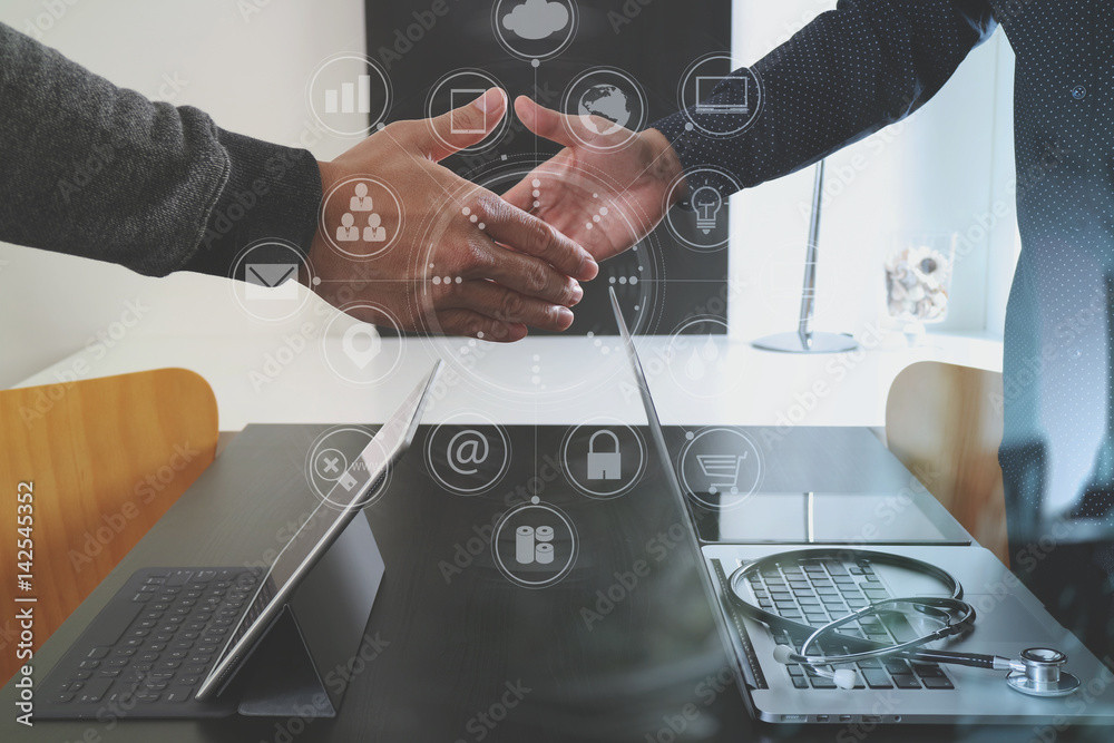 Fototapeta premium Medical and healthcare concept,Doctor and patient shaking hands in modern office at hospital