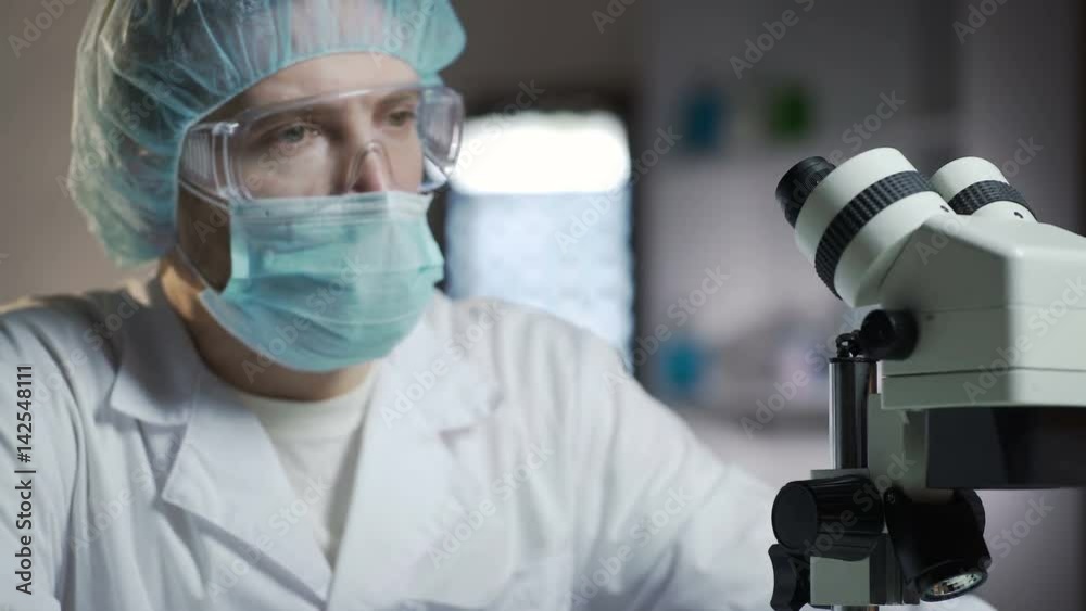 Male researcher nervously waiting for test results to prevent epidemic spreading Male researcher nervously waiting for test results to prevent epidemic spreading