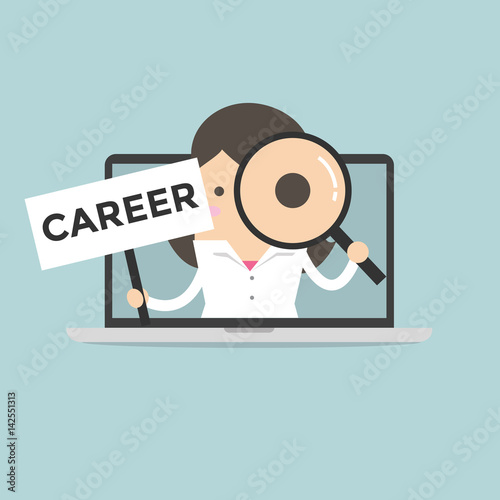 Businesswoman holding CAREER sign and looking through a magnifying glass in computer notebook