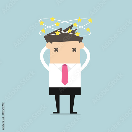 Businessman with stars spinning around his head. vector