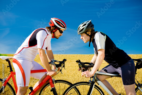 Two Bicyclists Staring At Each Other