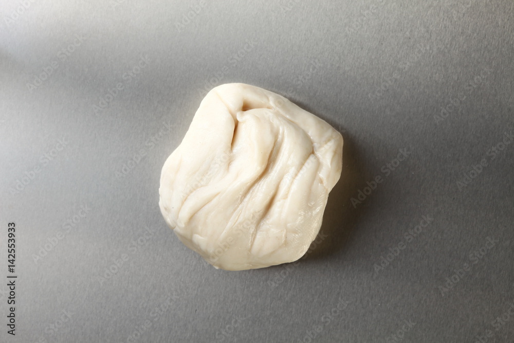 White powder for roti raw material put on the tinplate represent the Indian food background concept related idea. White powder for roti raw material put on the tinplate represent the Indian food background concept related idea.