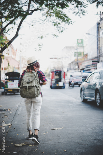 Wallpaper Mural Happy hipster young woman carry backpack, Travel tourist woman with backpack outdoors during holidays. Women lifestyle concept. Torontodigital.ca