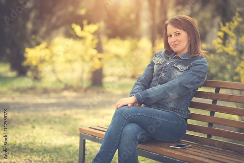 Cute woman sitting on the bench