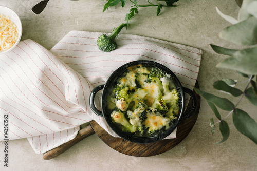 Broccoli with béchamel sauce and gratin cheese photo