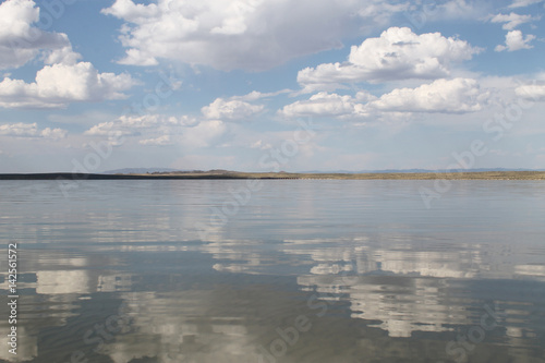 the sky reflected in the water  deserted beach lake  summer sky  nature  blue cloud 