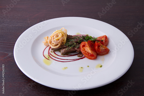 sliced beef served with home made pasta and tomato